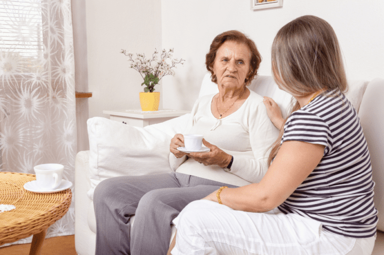 Carer and service user having a cup of tea